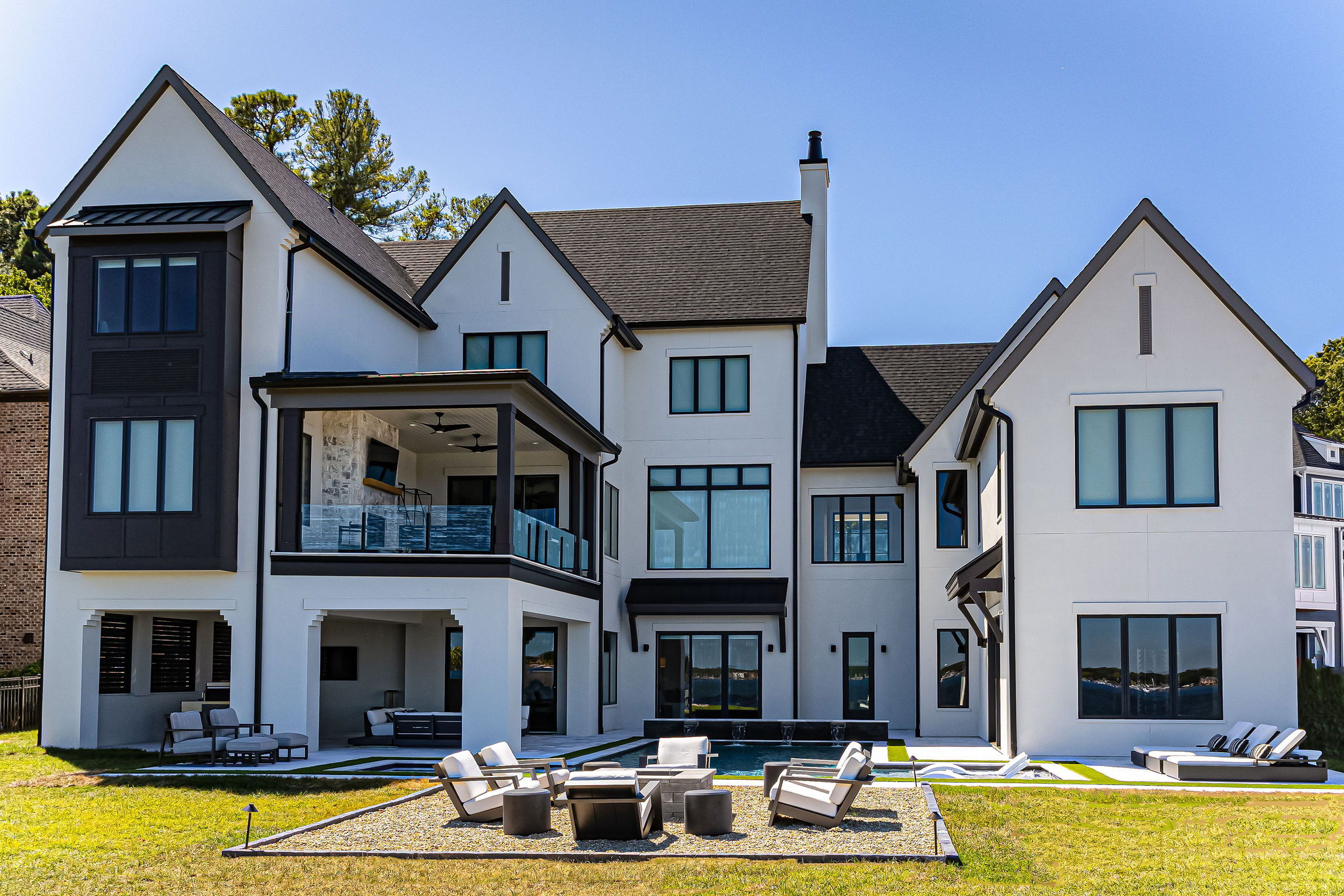 Lakefront home with a poolside entertaining area